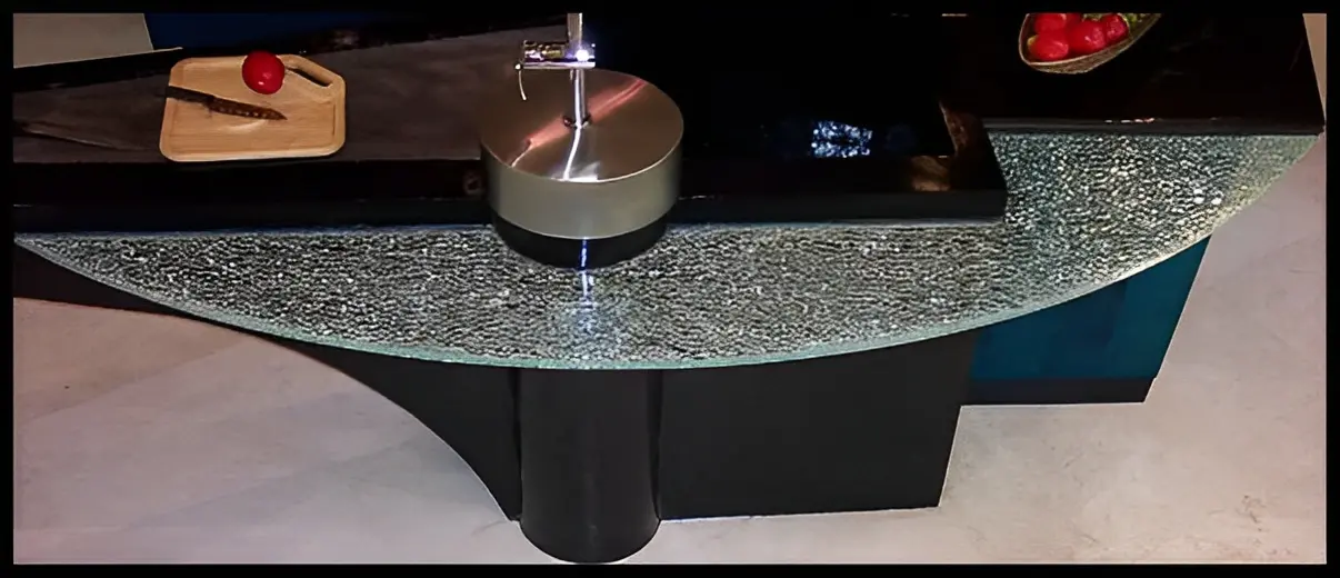 Modern glass table with decorative items.